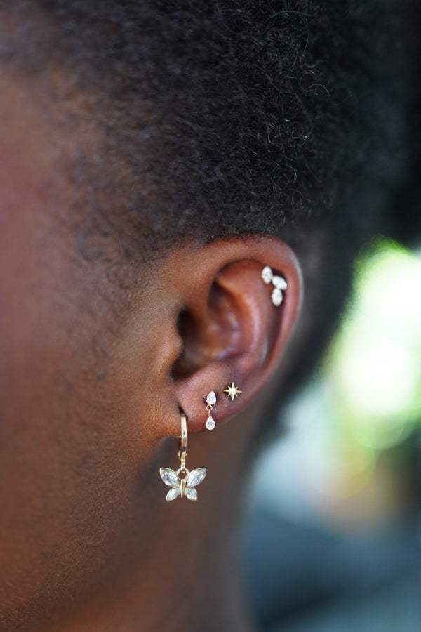 Healed ear piercings including outer rim cartilage and lobe jewellery
