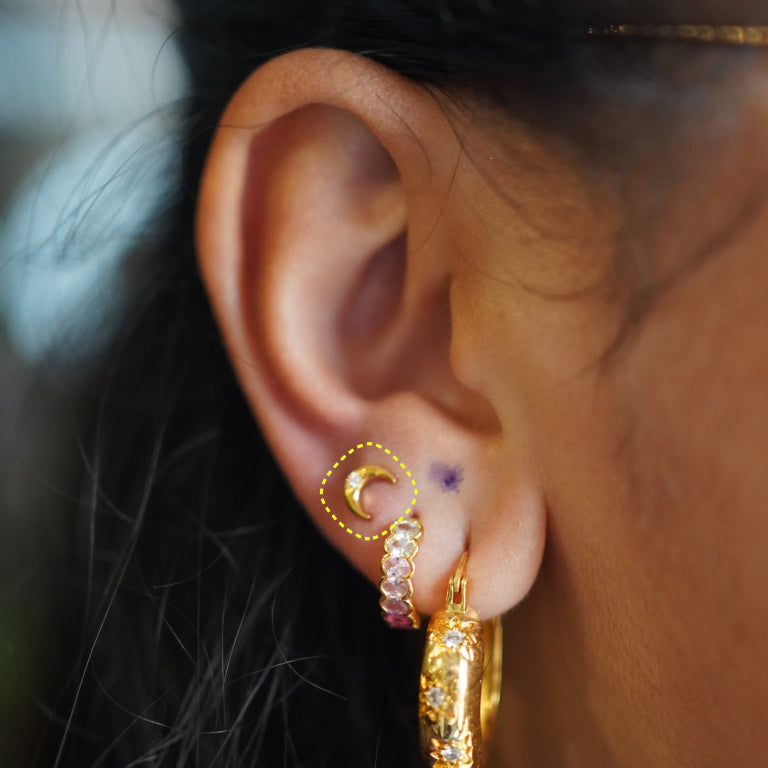 Moon flatback earring worn on the ear