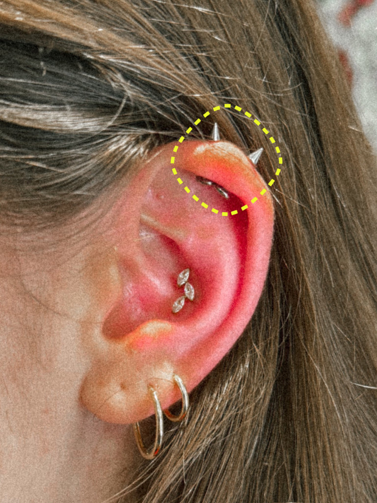 Spike flatback earring worn on the ear